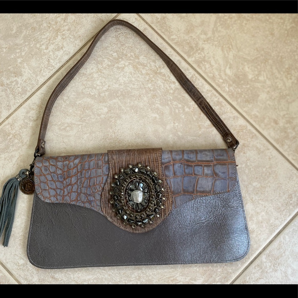 Standout Leatherock embellished convertible clutch bag.